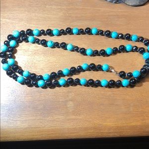 Double length beaded necklace